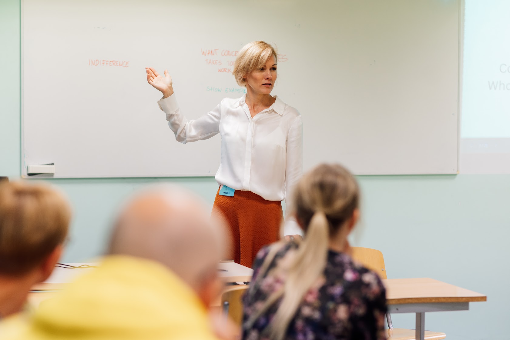 Trainer facilitating a participatory learning exercise during a professional development workshop